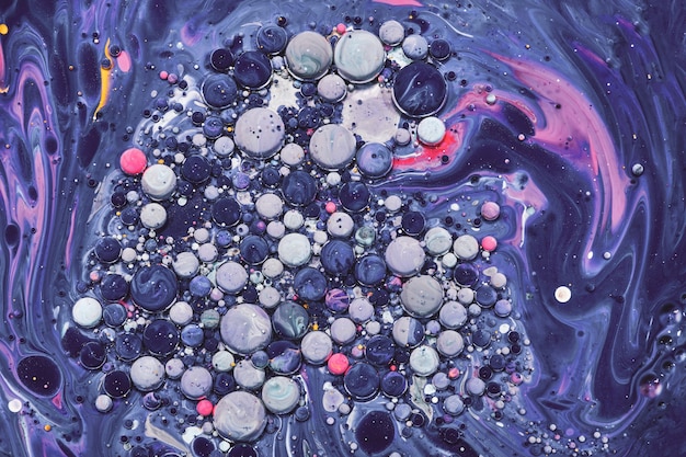 Photo colourful acrylic bubbles.fluid art marble texture. backdrop  abstract iridescent paint effect. liquid acrylic artwork  flows and splashes. mixed paints for interior poster.