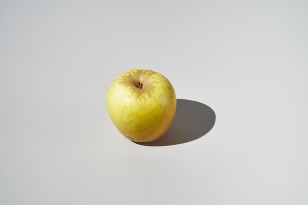 Colourful apple on grey background View from top