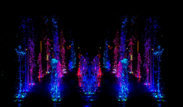 colourful background from waterwork with color LED light at night background.