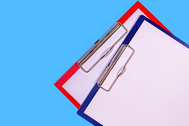 Colourful clipboards isolated on blue