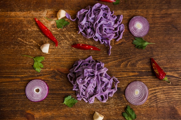 Colourful cooked fettuccine on table closeup