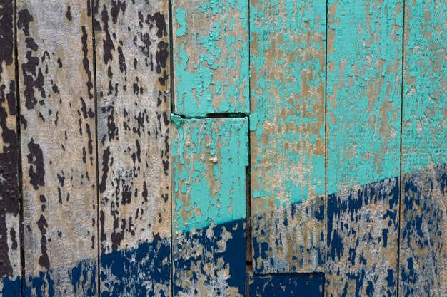 Colourful distressed wooden texture background painted blue