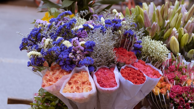 Colourful flowers bunch together in the market.