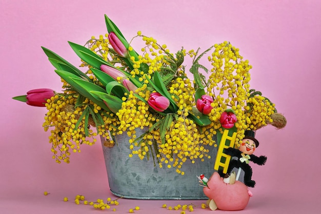 Colourful flowers in vase with pig and chimney sweeper