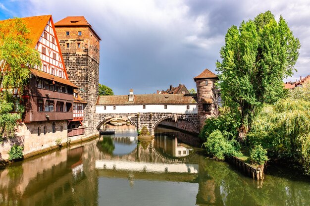 Colourful historic old town with halftimbered houses of nuremberg bridges over pegnitz river