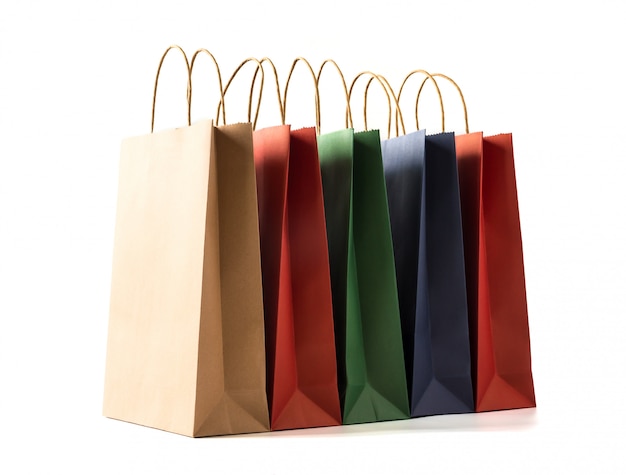 Colourful paper shopping bags on white background