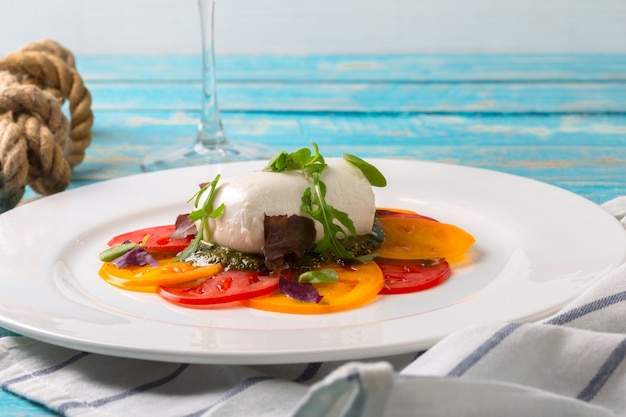 Colourful slices of cheese and tomato