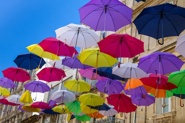 colourful sun umbrellas against the blue sky street decoration