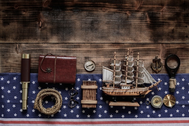 Photo columbus day background. map and discovery of old equipment. exploration and history of america in october.