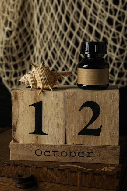 Columbus Day Wooden calendar with a shell