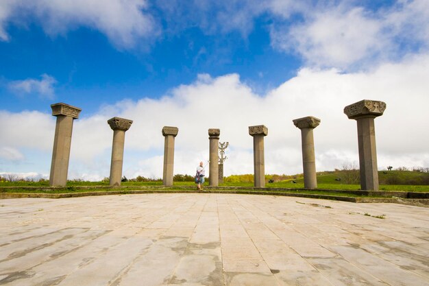 Columns in park against sky in city