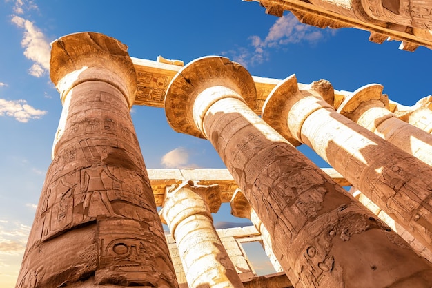 Columns with ancient carvings in the Great Hypostyle Hall of Karnak Temple Luxor Egypt