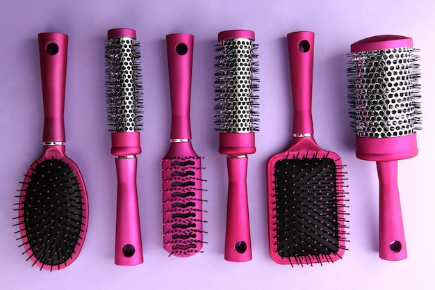 Photo comb brushes on purple background