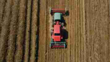 Photo combine harvester from a birds eye view in field