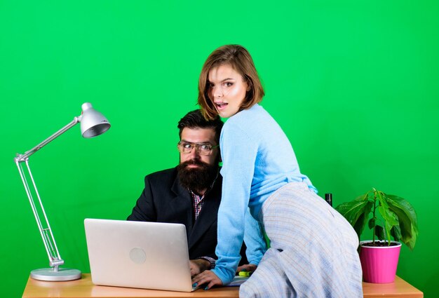 Photo combining their expertise sexual harassment data and information businessman and assistant has problem woman and man work in office business couple at computer secretary with boss at workplace