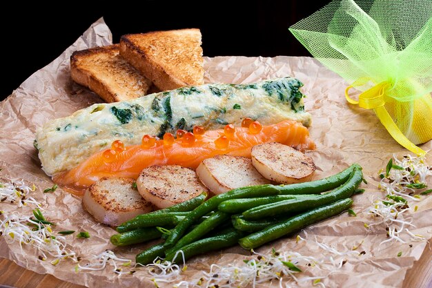 Combo salad omelette with spinach salmon with cheese beans potato croutons