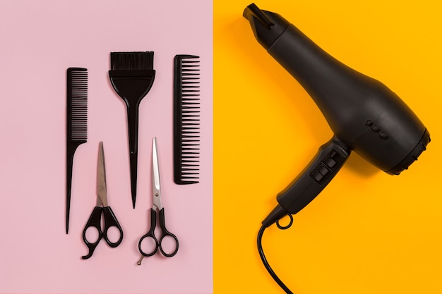 Combs and hairdresser tools on color background top view. Copy space. Flat lay. Still life. Mock-up