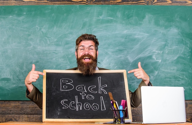 Come to us teacher welcomes new pupils enter educational
institution private school advertising to boost enrollments teacher
or school principal welcomes with blackboard inscription back to
school