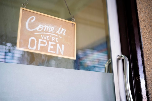 Come in we're open vintage retro sign in cafe front