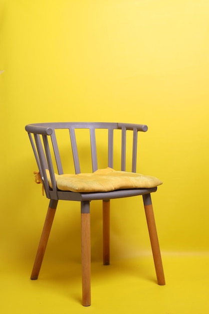 comfortable chair for work and relax isolated over yellow background