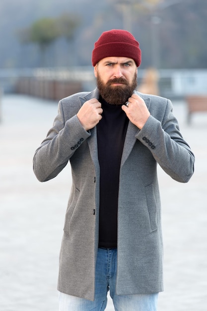 Comfortable and cool. Outfit hat accessory. Hipster outfit. Stylish casual outfit for fall and winter season. Menswear and male fashion concept. Man bearded hipster stylish fashionable coat and hat.