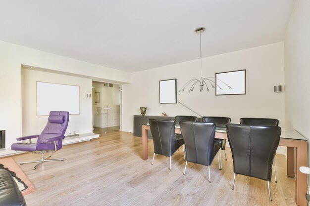 Comfortable dining room with black chairs and a wooden table