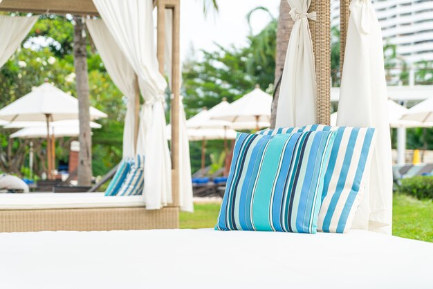 comfortable pillow on pavilion near beach - travel and vacation concept