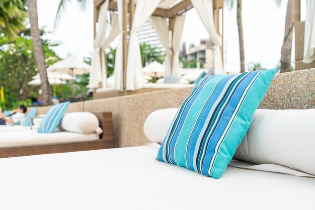 comfortable pillow on pavilion near beach - travel and vacation concept