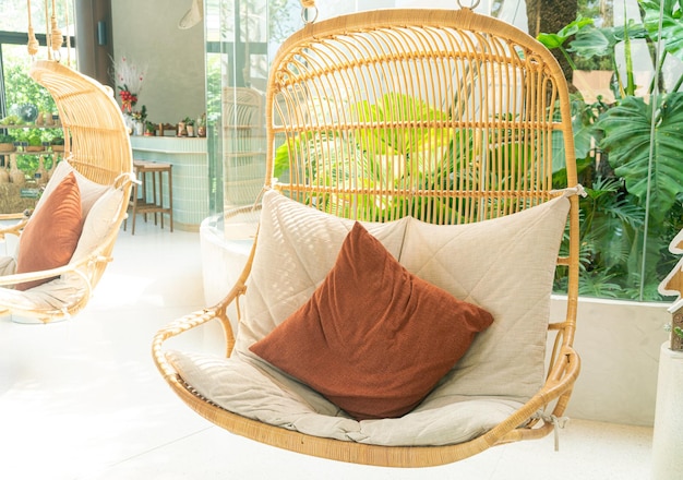 comfortable pillow on wicker or rattan swing chair