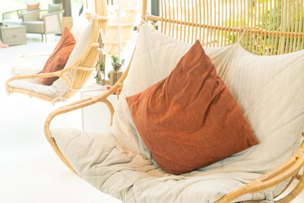 comfortable pillow on wicker or rattan swing chair