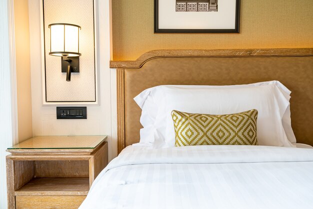 comfortable pillows decoration on bed in hotel bedroom