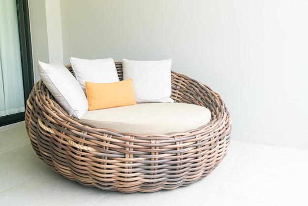 comfortable pillows on outdoor patio wicker sofa