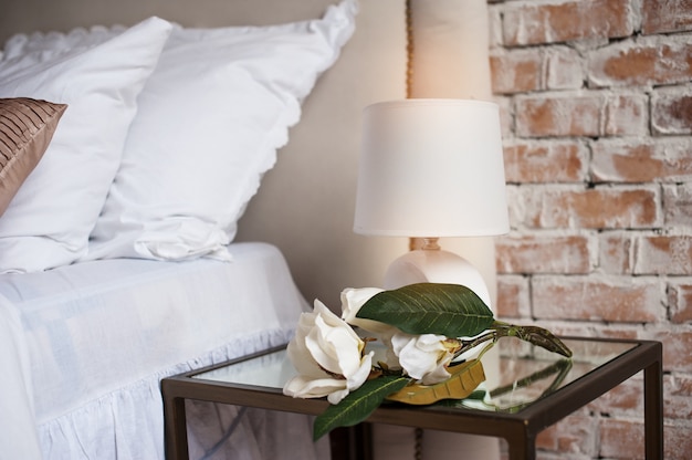 Comfortable and serene bedside with lamp by the bed