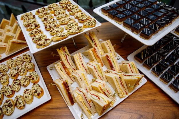 Comfortable triangular sandwiches on the banquet table.