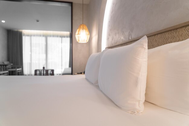 Comfortable white pillows on bed