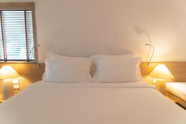 Comfortable white pillows on bed