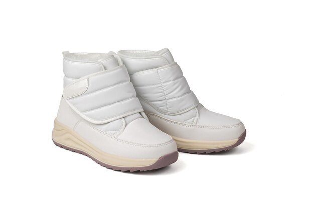 Comfortable white women's sports shoes insulated on a white background.