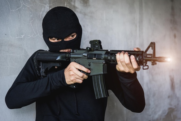 Commando with Helmet holding M16 gun