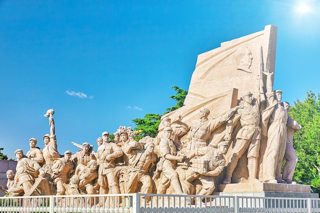 Photo commemorating statues of workers in struggle in the revolution of china located near  mausoleum of mao zedong, beijing. china.