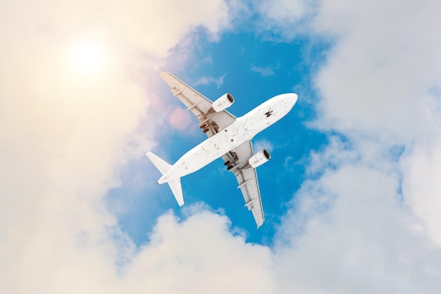 Commercial airplane flying above clouds in divine sun light