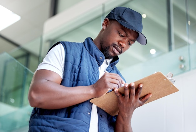 Committed to delivering on time. Shot of a man delivering a package in a building.