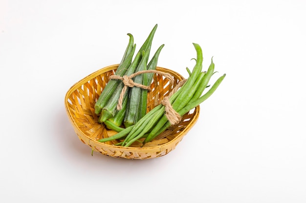 Common bean or dolichos bean pods and okra, farm fresh concept