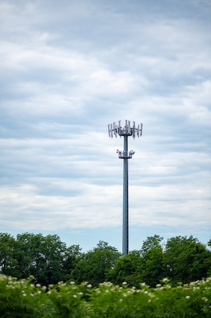 communication tower 5g against the background of the cloudy sky