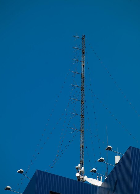 Communications antenna on the roof of a high standing at home