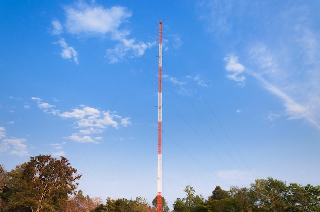 Photo communications tower radio telephone telecom with a blue sky background