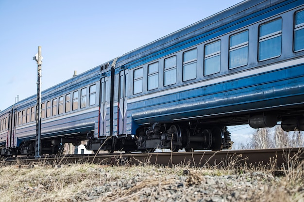 A commuter train moves on rails.