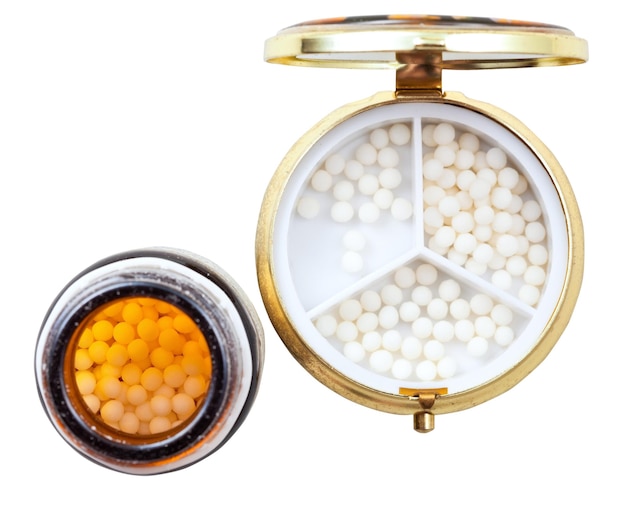 Compacte pillendoos en pot met homeopathieballen