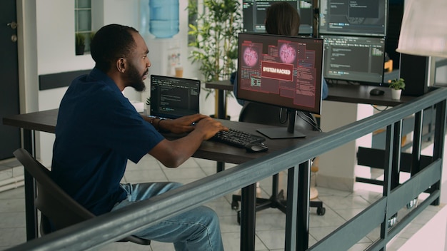 company developer writing code encounters system failure, parsing algorithm and having computer hacked. database coder having unexpected compiling error in software development office.
