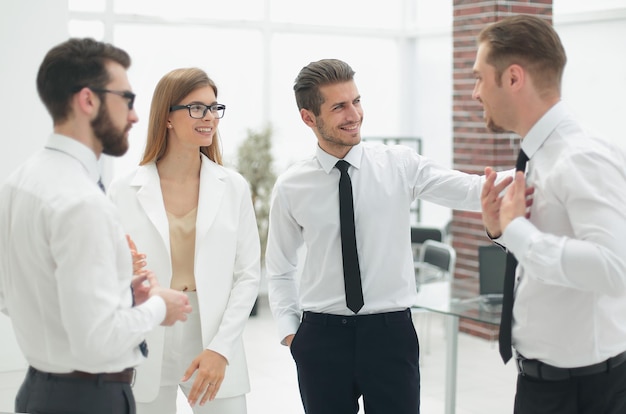 Company employees discussing current tasksthe concept of teamwork