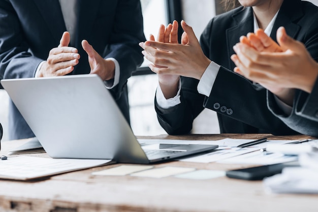 Company meeting room has businessmen and finance managers meeting together on finance topics they are applauding after the meeting is over Concept company financial management